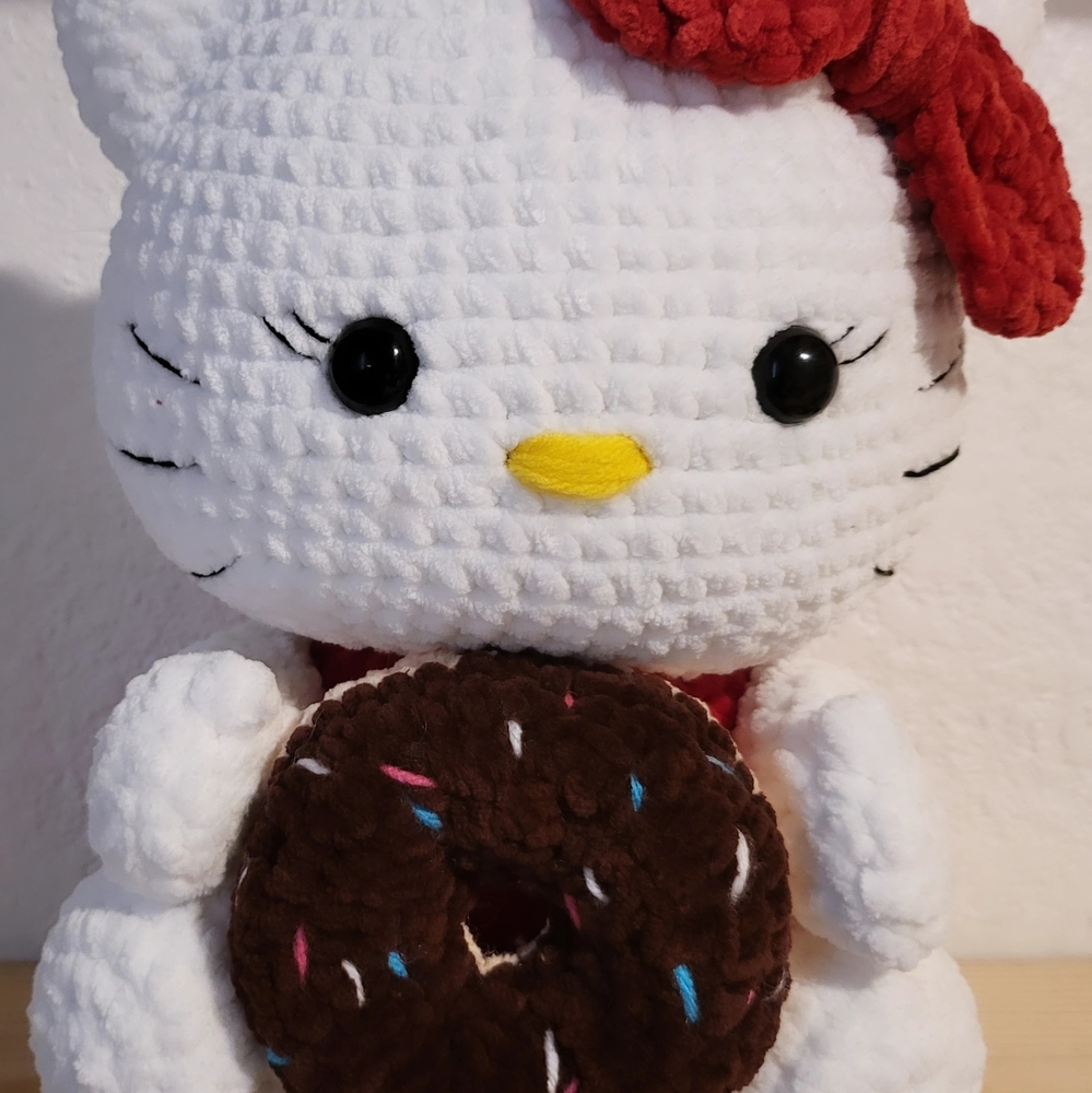 White Plush Toy with Red Bow and Brown Donut